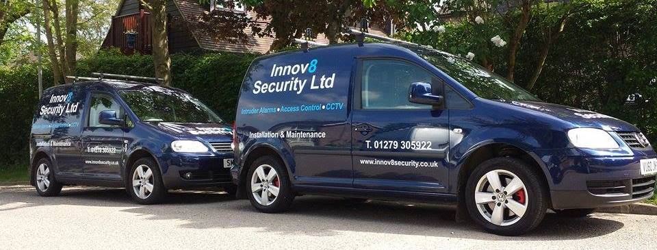 Two Innov8 Security vans parked outside the office, signwritten with intruder alarms, access control and CCTV services